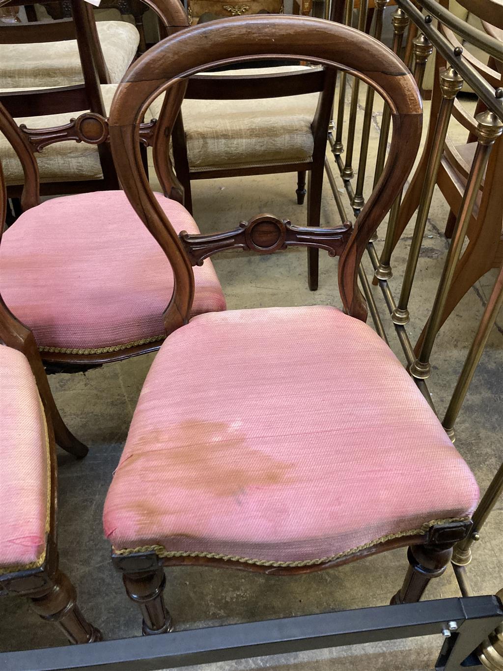 A set of six Victorian rosewood spoon back dining chairs